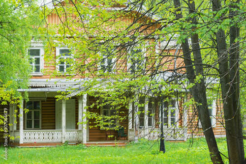 Old wooden house in the garden. Russia.