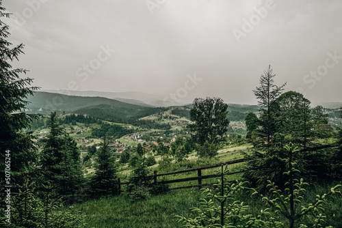 The rain starts in the mountains. Dark rain clouds covered the sky in Goah in summer. photo