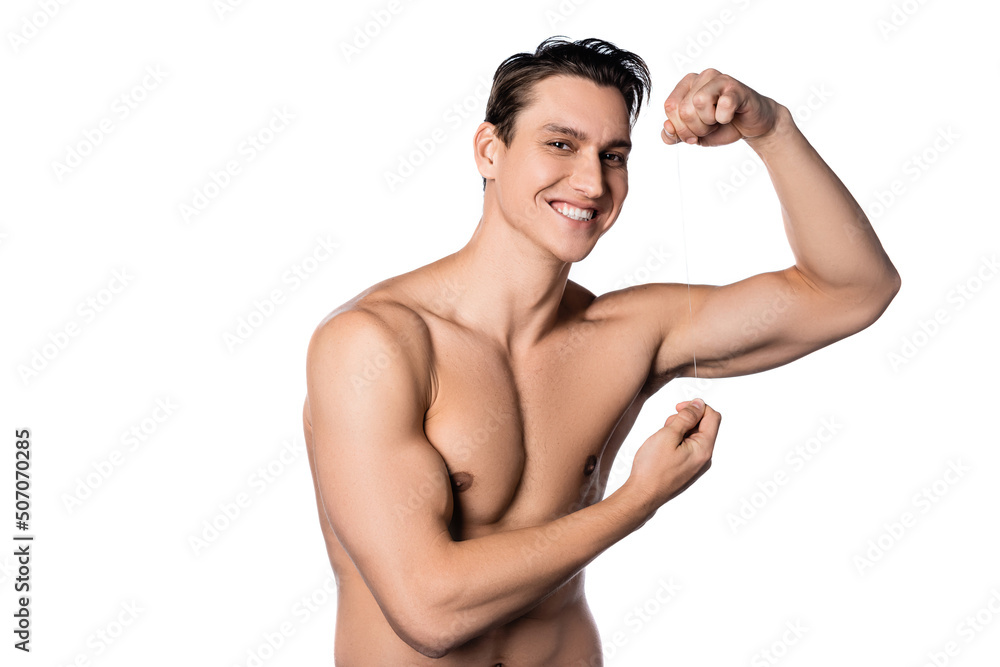 cheerful shirtless man posing with dental floss isolated on white. cheerful shirtless man posing with dental floss isolated on white.