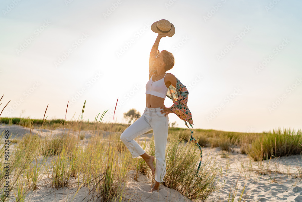 Fototapeta premium stylish attractive slim smiling woman on beach in summer style fashion trend outfit