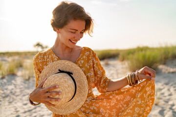 stylish attractive slim smiling woman on beach in summer style fashion trend outfit