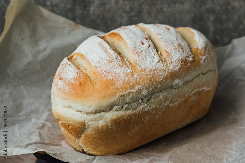 Homemade, fresh bread cools down after baking. Selective focus. place for text