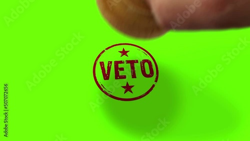 Veto stamp and hand stamping impact isolated animation. Opposition, objection and refuse symbol 3D rendered concept. Alpha matte channel. photo