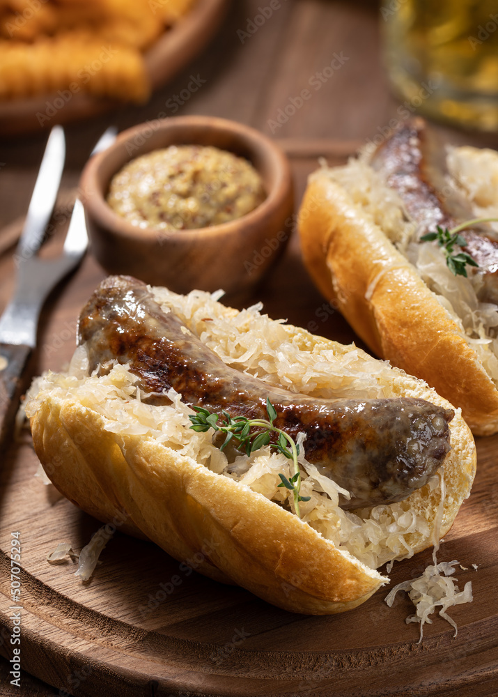 Bratwurst with saurkraut on a bun Bratwurst with saurkraut on a bun