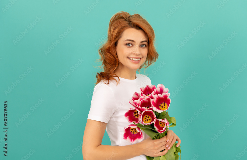 cheerful girl with tulip flower bouquet on blue background cheerful girl with tulip flower bouquet on blue background