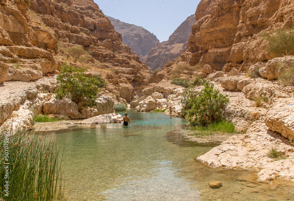 Tiwi, Oman famous of its vertical cliffs and the green water, Wadi Shab is one of the most
