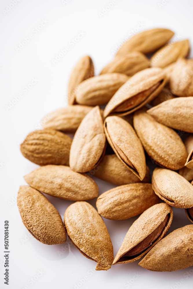 fresh almonds in shell on a white background fresh almonds in shell on a white background