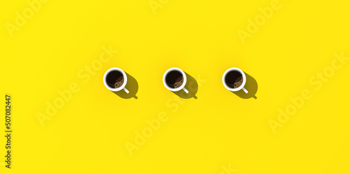 three white cups of coffee on yellow background. view from above. Banner for insertion into site. horizontal image. 3D image. 3D rendering.