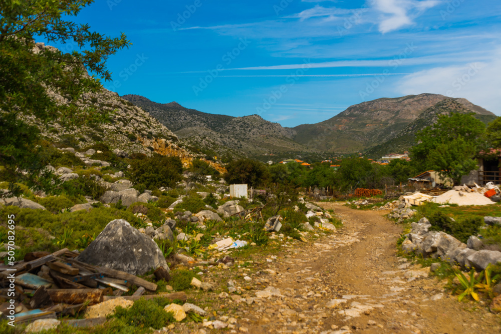 Obraz premium BOZBURUN, MUGLA, TURKEY: Landscape with a view of the road and mountains in Bozburun village