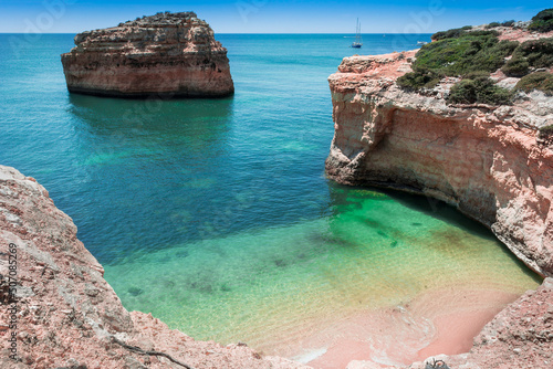 Secluded exotic beach next to high rocks in the algarve, Portugal