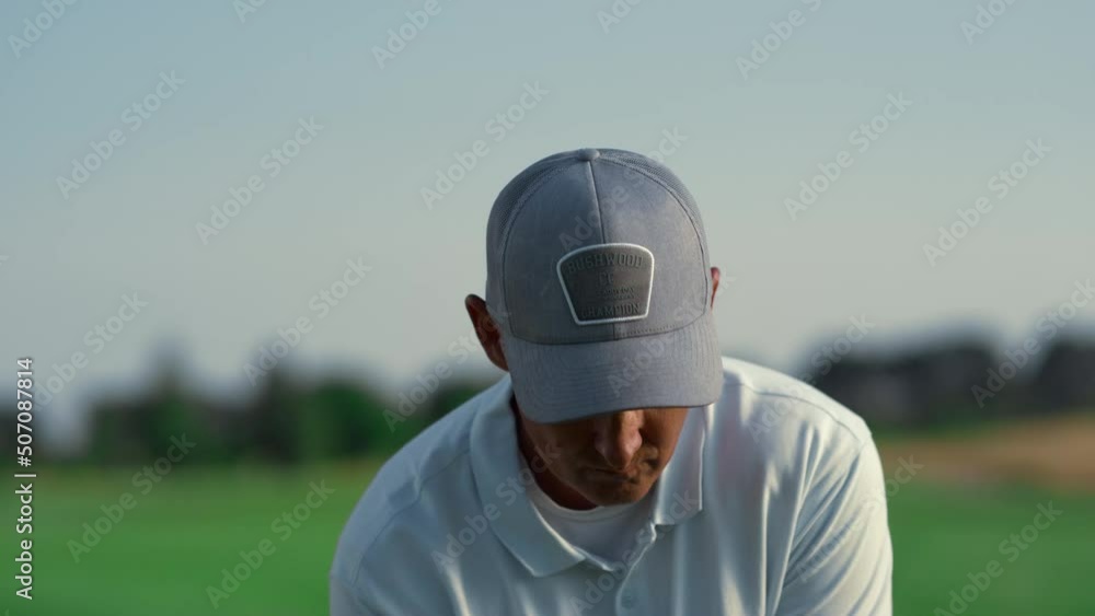 Senior hitting golf ball on course. Rich man play golfing game on sunny weekend. Senior hitting golf ball on course. Rich man play golfing game on sunny weekend.