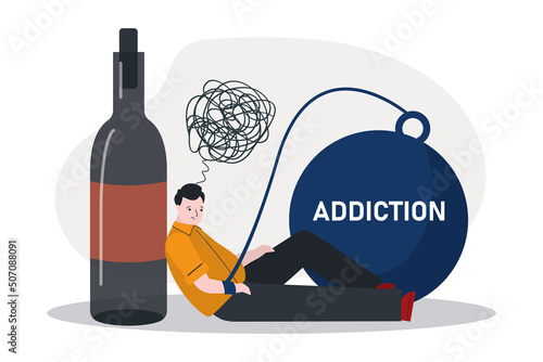 Sad male alcoholic chained to bottle of alcohol drinks. Depressed man addicted to drinking. Sitting guy have alcohol and drug addiction