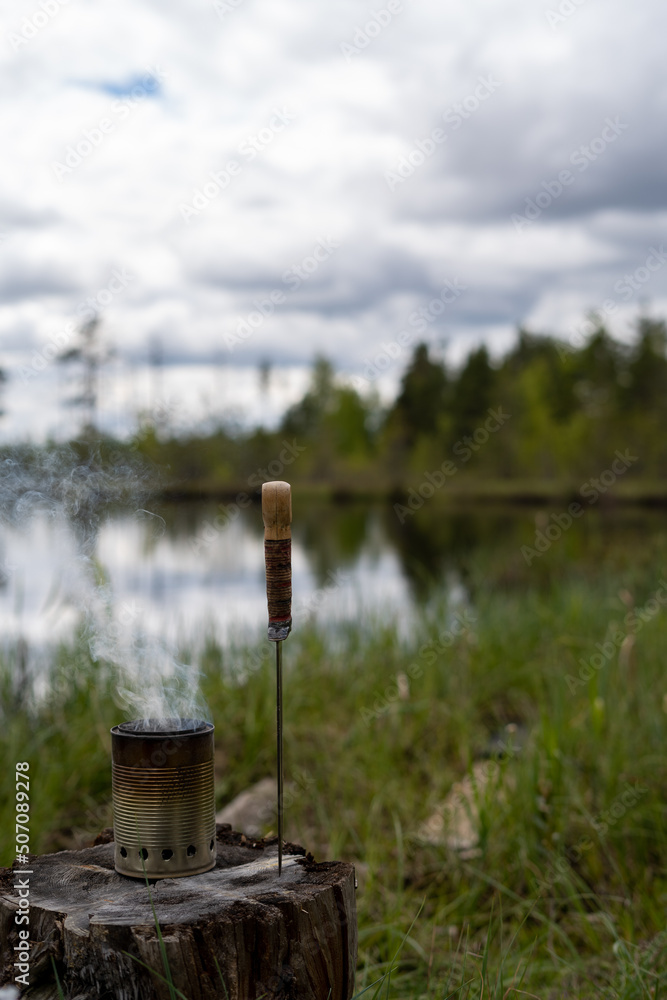 breakfast of eggs and bread in the wild forest by the lake on a fire breakfast of eggs and bread in the wild forest by the lake on a fire