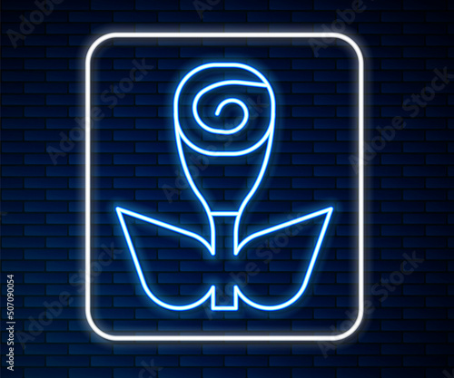 Glowing neon line Flower rose icon isolated on brick wall background. Vector