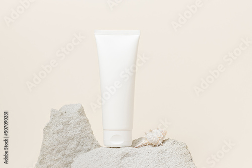 Obraz na plátně White unbranded face cream tube on stone podium, summer concept skin care