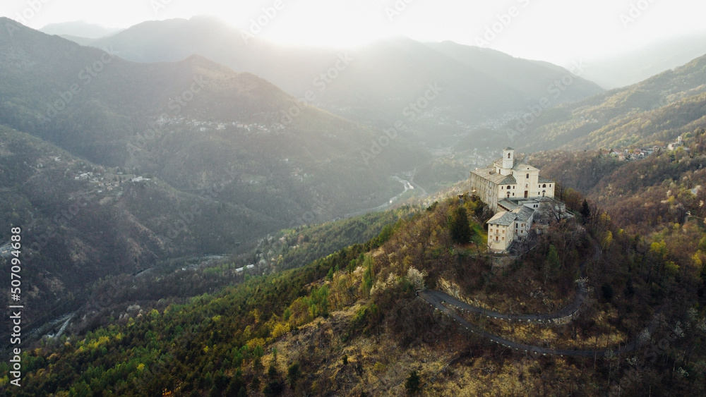 Aerial view of Sanctuary of Saint Ignatius of Loyola situated in the Lanzo Valleys in Italy. Tourist attraction and famous place of pilgrimage in Province of Turin, Piedmont region. Drone photography.