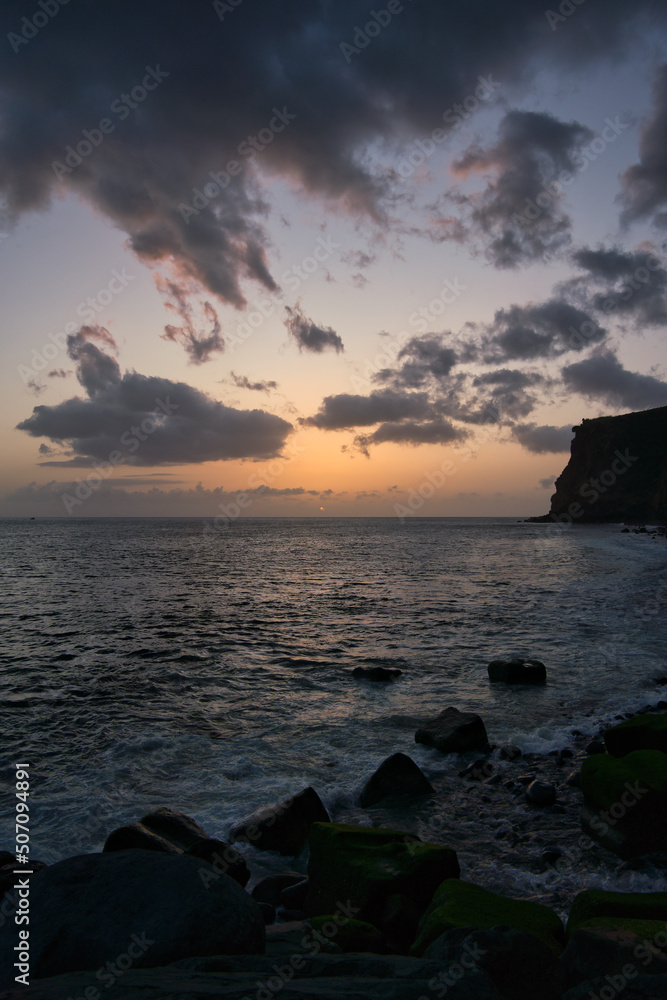 Beautiful sunset on the Atlantic Ocean off the coast of Madeira island, Portugal, seen from Calheta