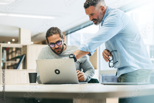 Two entrepreneurs sharing business ideas in an office