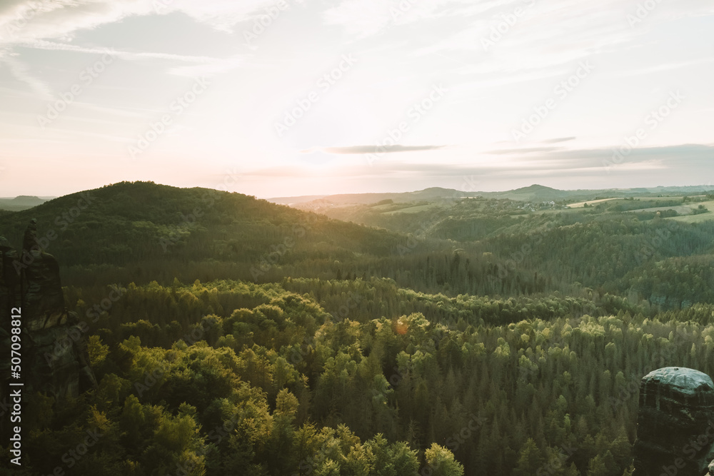 Fototapeta premium Sunset at mountain Schrammsteine (Elbsandsteingebirges). View from Häntzschelstiege in Saxon Switzerland National Park, Germany