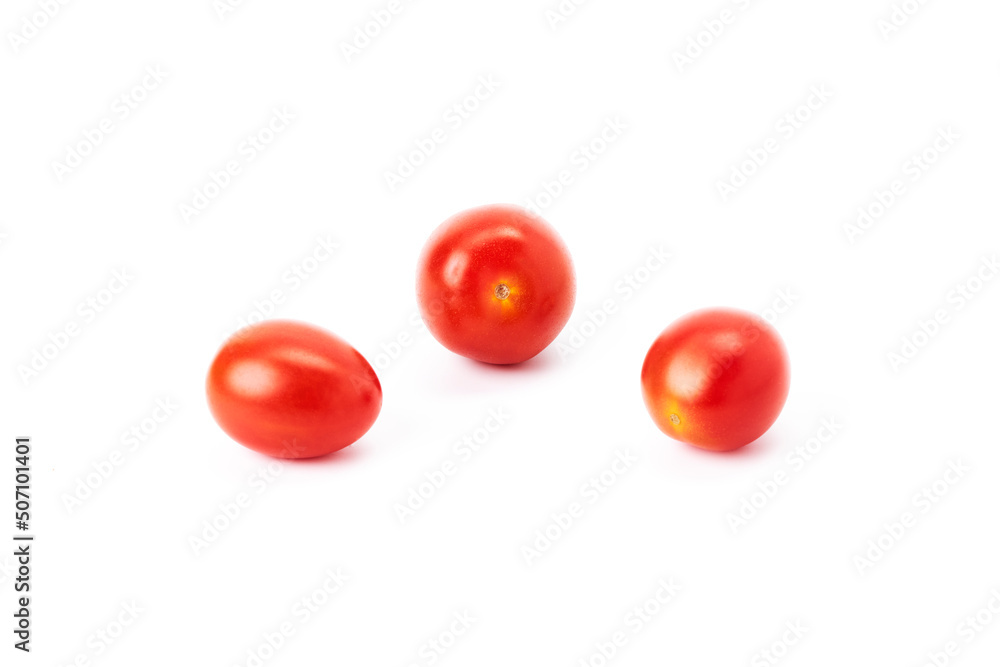 Three ripe red cherry tomatoes on a white background Three ripe red cherry tomatoes on a white background