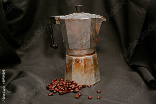 Mokapot coffee filled with brown ground coffee