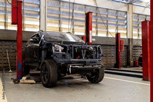 car in automobile repair service center with soft-focus and over light in the background