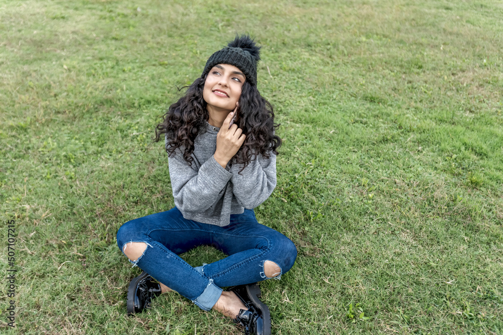 young stylish smiling woman using smartphone, talking. young stylish smiling woman using smartphone, talking.