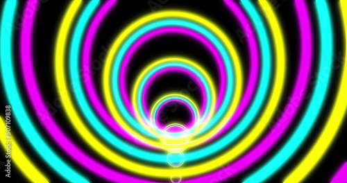 Image of purple blue and yellow circles neon pattern moving in hypnotic motion on seamless loop