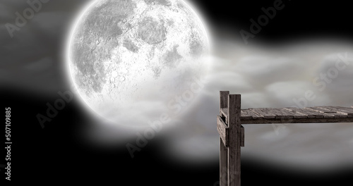 Image of wooden jetty over full moon and clouds on night sky in background