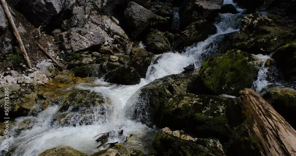 water flowing over the stones of the river water flowing over the stones of the river