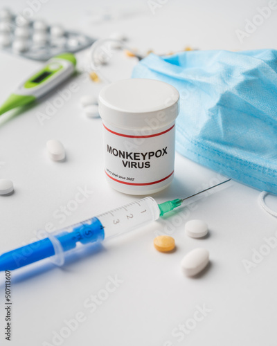 Monkeypox virus illustration photography with injection thermometer and pills