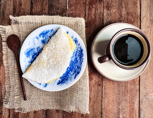 Canvas-taulu tapioca with cheese accompanied by black coffee on a wooden background