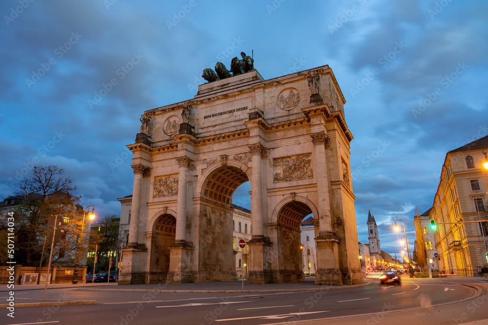 Victory gate Siegestor in Munich Germany with traffic lights in the evening