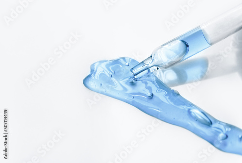 Wallpaper Mural Pipette with fluid serum, oil, face gel cleaner. Cosmetics and healthcare concept closeup. Dose of retinol with air bubbles. Flat lay. Monkeypox, coronavirus research Torontodigital.ca