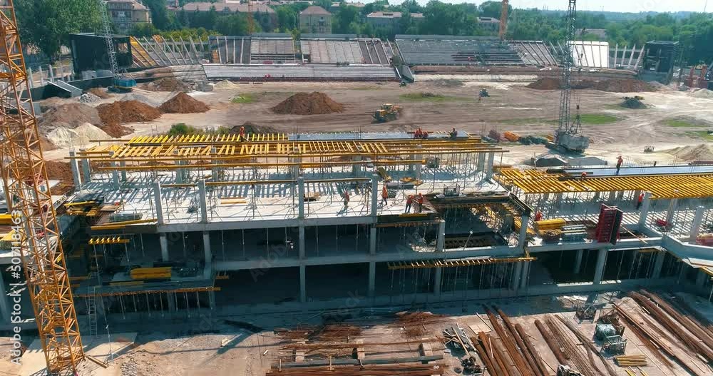 Construction process of a modern football stadium. Builders make