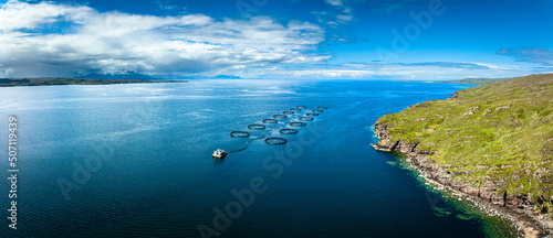 Aerial view of the landscape surrounding Diabaig, Lower Diabaig and Torridon village in the north west highlands of Scotland during summer on a blue sky day with light clouds