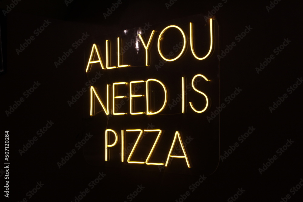 neon light advertisement in pizza restaurant