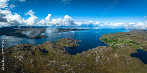Aerial view of the landscape surrounding Diabaig, Lower Diabaig and Torridon village in the north west highlands of Scotland during summer on a blue sky day with light clouds © Andy Morehouse