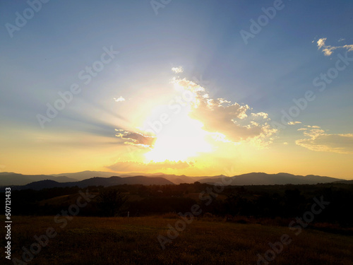 A gorgeous sunset with clouds in the sky on a warm summer's day in the Umbrian mountains. © bARTkow