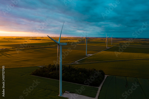 Wind Turbines Windmill Energy. Panoramic view of wind farm or wind park, with high wind turbines for generation electricity. Green energy concept. Concept of sustainable development technology. 