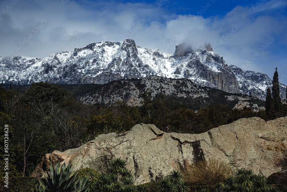 View of Ai-Petri mountains covered with snow from Vorontsov palace in Alupka. Crimea