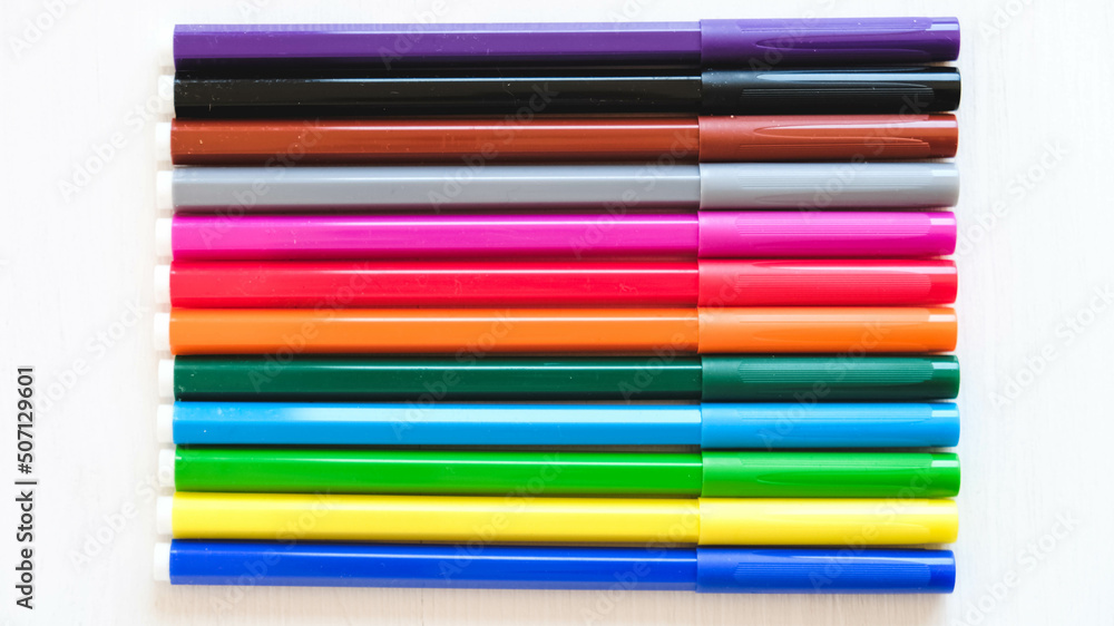 Multicolored felt-tip pens on a white background Multicolored felt-tip pens on a white background
