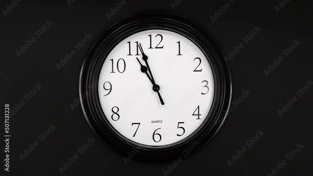 Classic Black And White Wall Clock With Black Background. Black Hands On The Clock. Timelapse. Wall Clock Face Beginning Of Time Of 11.00 Am Or Pm. 4k. ProRes. Classic Black And White Wall Clock With Black Background. Black Hands On The Clock. Timelapse. Wall Clock Face Beginning Of Time Of 11.00 Am Or Pm. 4k. ProRes.