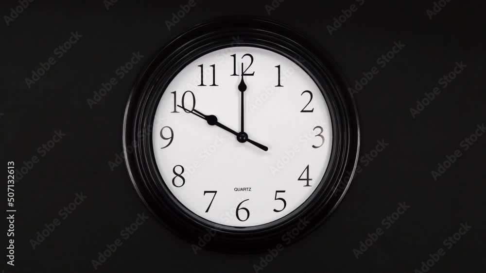 Classic Black And White Wall Clock With Black Background. Black Hands On The Clock. Wall Clock Face Of Time Of 10.00 Am Or Pm. 4k. ProRes. Classic Black And White Wall Clock With Black Background. Black Hands On The Clock. Wall Clock Face Of Time Of 10.00 Am Or Pm. 4k. ProRes.