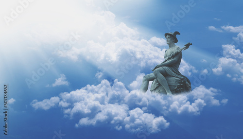 Ancient statue of the antique god of commerce, merchants and travelers Hermes (Mercury) in the clouds. He is olympic gods messenger with wings on his feet and helmet.