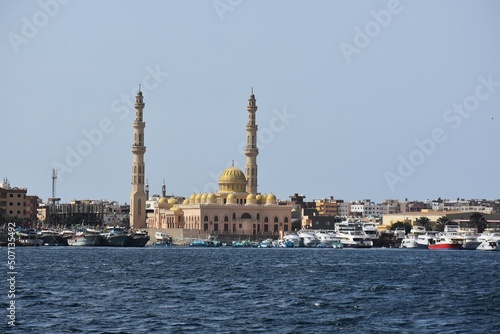 View of the coastline with the Mosque El Mina Masjid, yachts and buildings, in New Marina in Hurghada, Egypt.