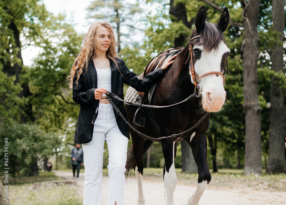Portrait of a woman walking with a horse Portrait of a woman walking with a horse