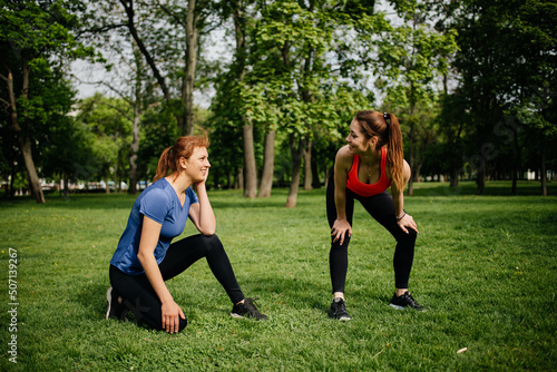 two people running in park