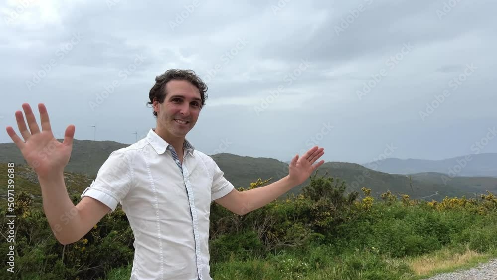 a man of European appearance points to the sky in all directions here you can put a text First he raises his hands to the right then looks to the left and is very happy. High quality 4k footage a man of European appearance points to the sky in all directions here you can put a text First he raises his hands to the right then looks to the left and is very happy. High quality 4k footage
