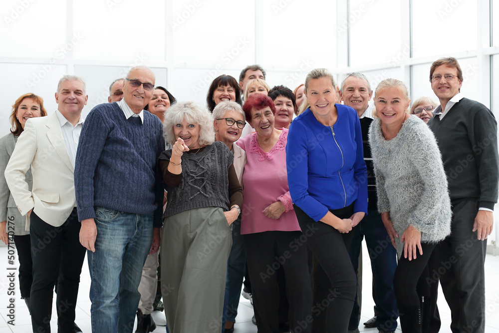 group of happy seniors look at camera